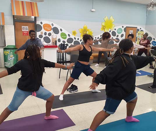 students doing yoga
